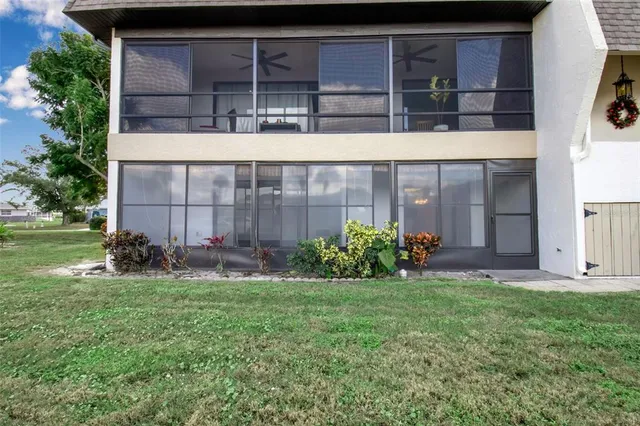 a view of a swimming pool with outdoor seating