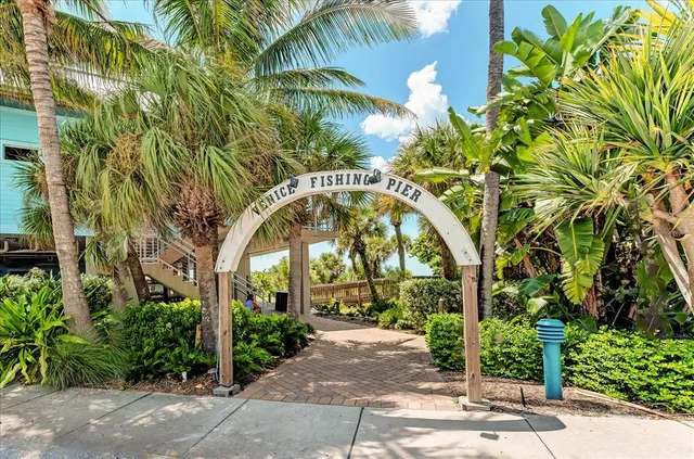 an aerial view of a house with a ocean view