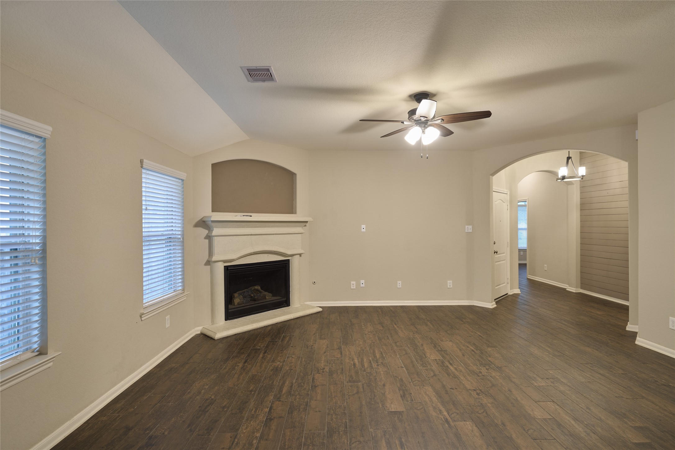 116 Fox Trail Road Montgomery, TX 77316 - Photo 14 of 50 The living room has soft neutral walls and large windows for natural light which creates a cozy living space.