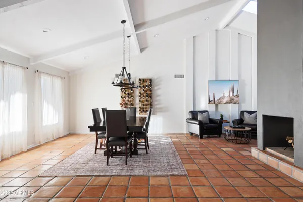 a living room with furniture a ceiling fan and a rug