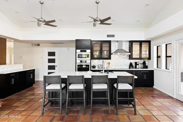 a kitchen with a sink cabinets and window