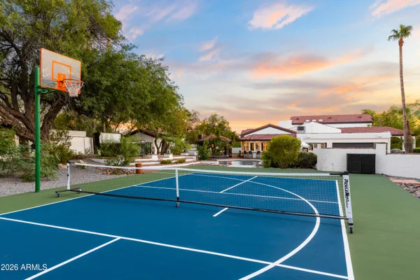 a view of an outdoor space and tennis court