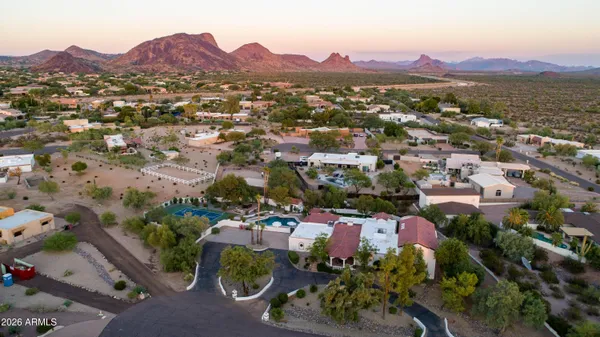 an aerial view of a houses with a street