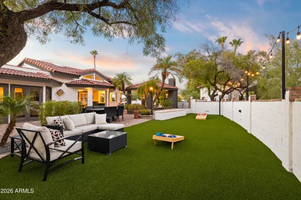 a view of yard with swimming pool and trees