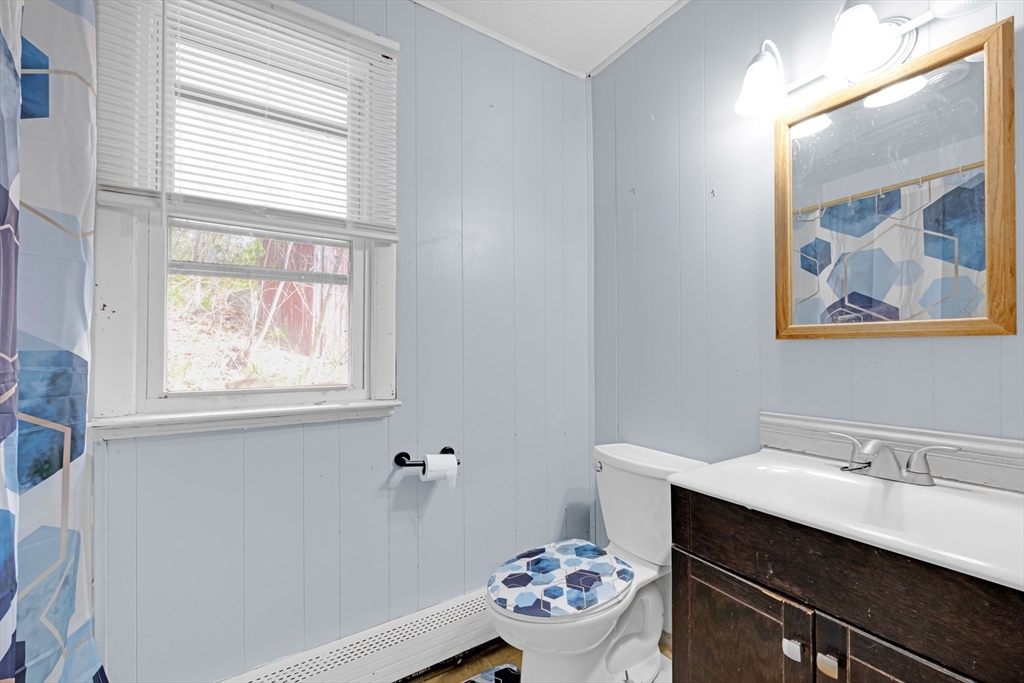 746-748 Alden Street Springfield, MA 01109 - Photo 22 of 22 a bathroom with a sink mirror and window