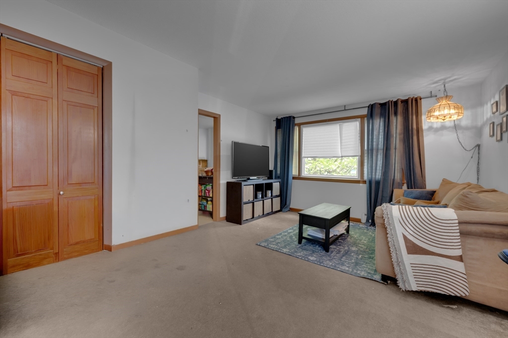 746-748 Alden Street Springfield, MA 01109 - Photo 5 of 22 a living room with furniture and a window