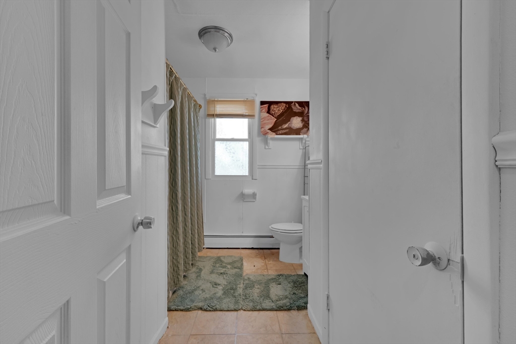 746-748 Alden Street Springfield, MA 01109 - Photo 8 of 22 a bathroom with a toilet and a shower