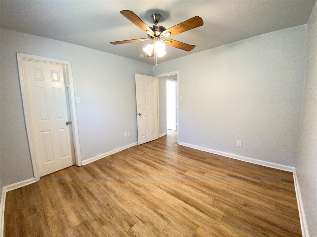 6928 Alexandria Court Fort Worth, TX 76133 - Photo 16 of 28 wooden floor in an empty room