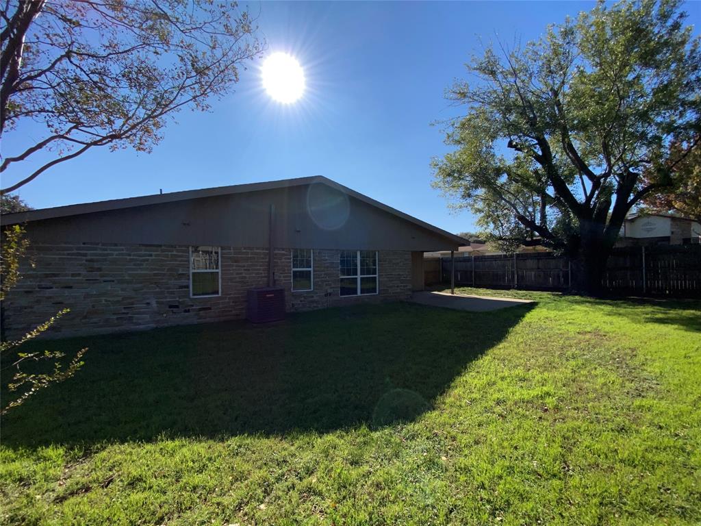 6928 Alexandria Court Fort Worth, TX 76133 - Photo 26 of 28 a house view with a garden space