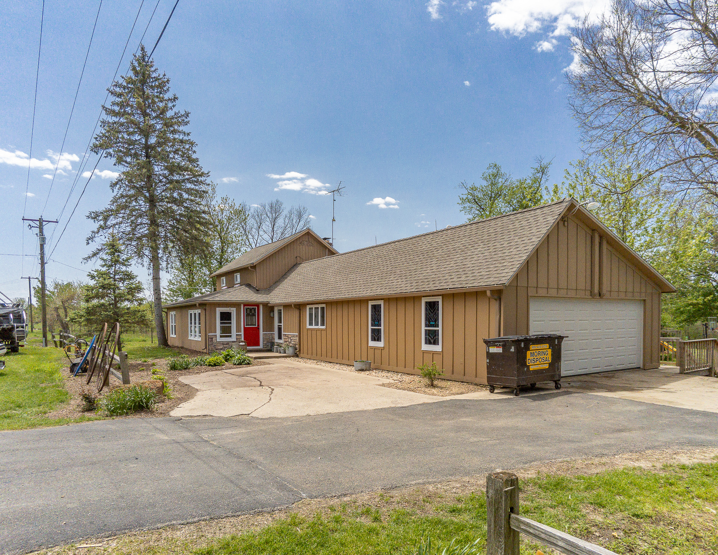 4318 North River Road Byron, IL 61010 - Photo 1 of 28 a front view of a house with a yard