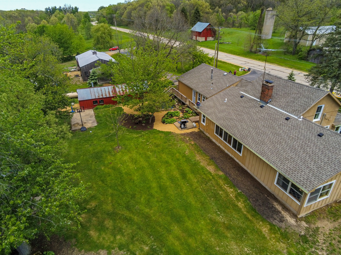 4318 North River Road Byron, IL 61010 - Photo 3 of 28 an aerial view of a house with a garden and swimming pool
