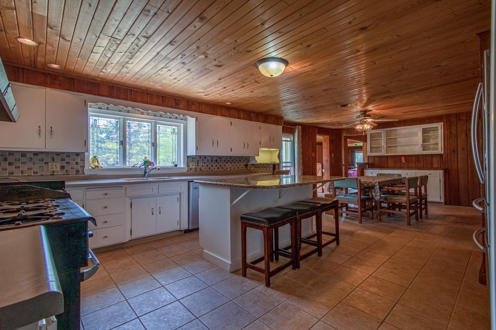 4318 North River Road Byron, IL 61010 - Photo 21 of 28 a kitchen with lots of counter top space and dining table