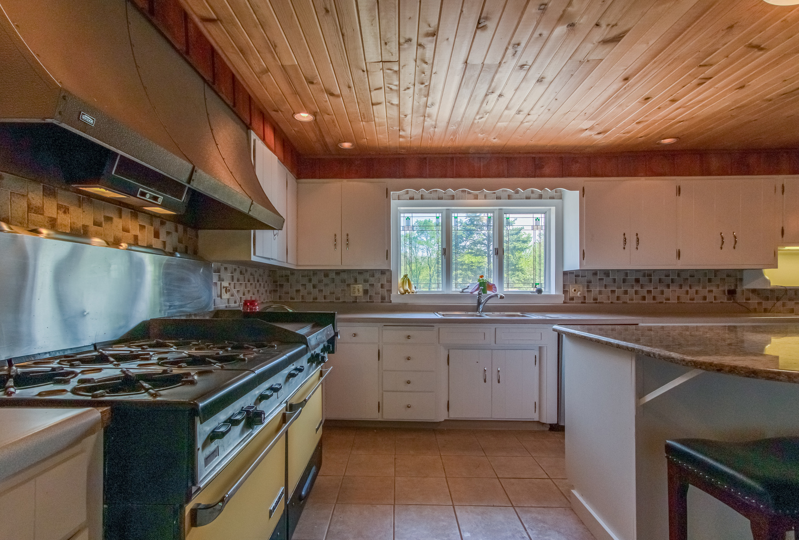 4318 North River Road Byron, IL 61010 - Photo 22 of 28 a kitchen with a stove and a sink