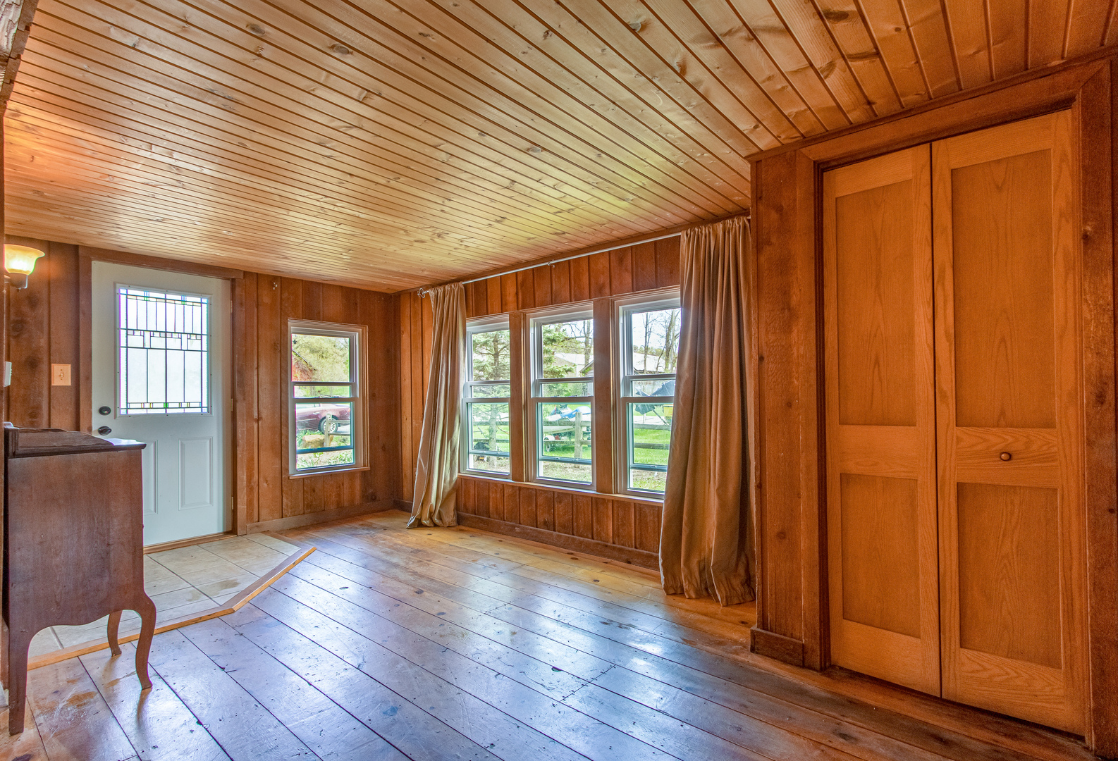 4318 North River Road Byron, IL 61010 - Photo 8 of 28 a view of an empty room with wooden floor and a window