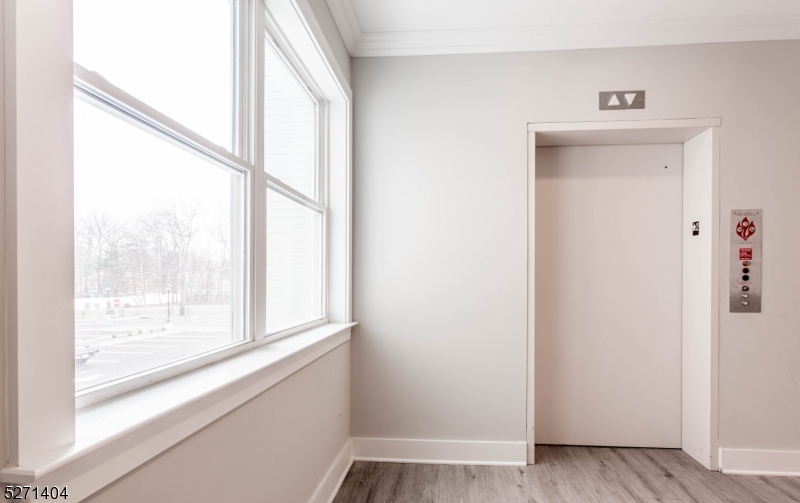 1025 Raritan Road, Unit 303 Clark, NJ 07066 - Photo 9 of 21 a view of an entryway with wooden floor