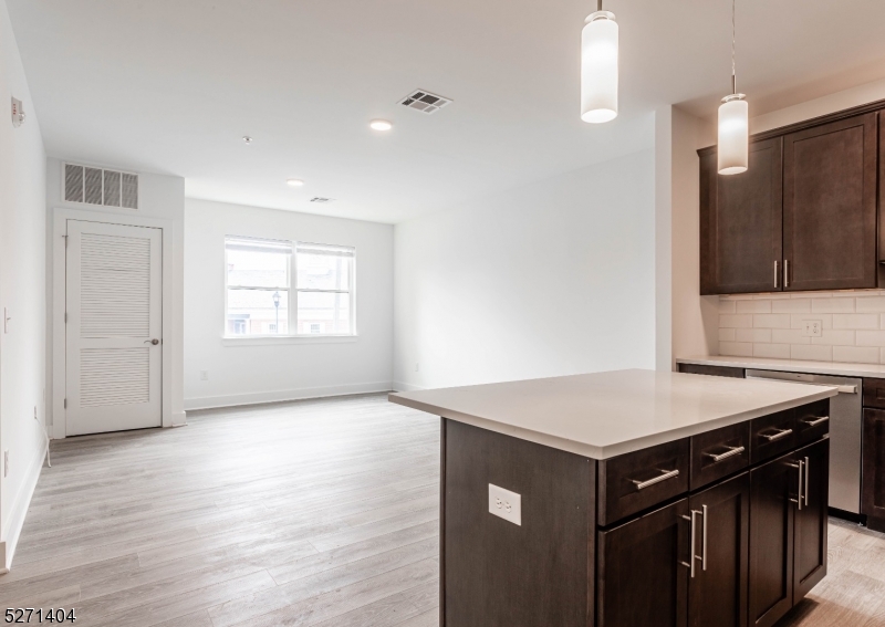 1025 Raritan Road, Unit 303 Clark, NJ 07066 - Photo 10 of 21 a kitchen that has a sink and a stove in it