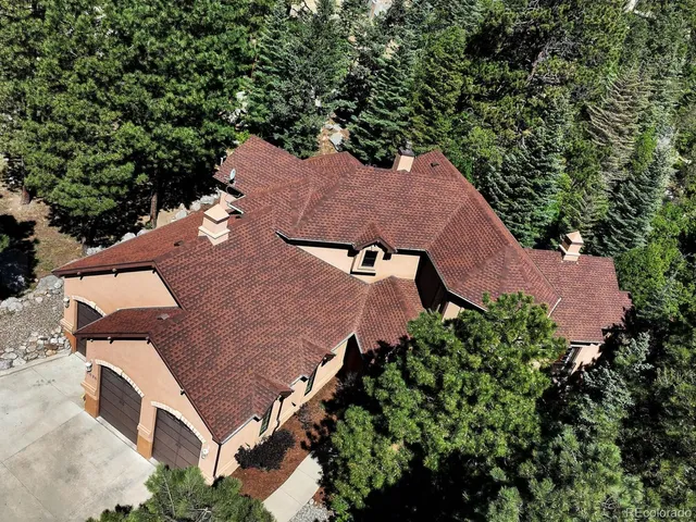 an aerial view of house with yard