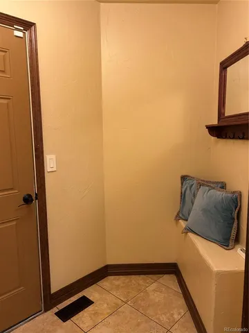 a spacious bathroom with double sink and a mirror