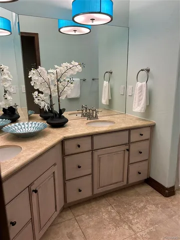 a view of a house with a yard and pathway