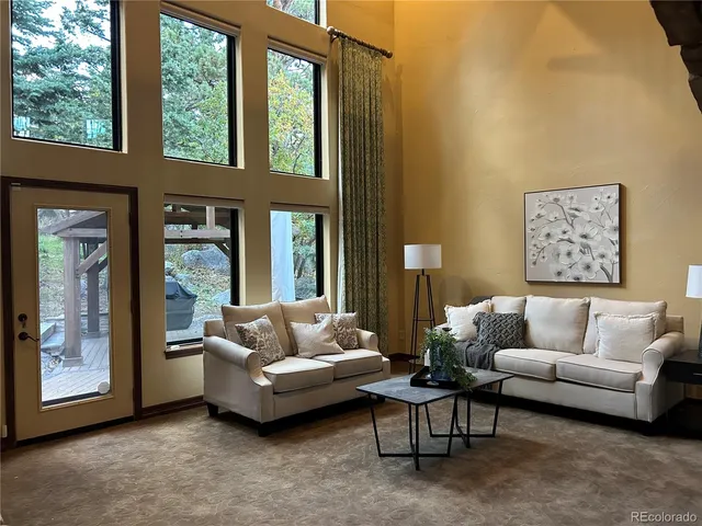 a kitchen with a sink cabinets and wooden floor
