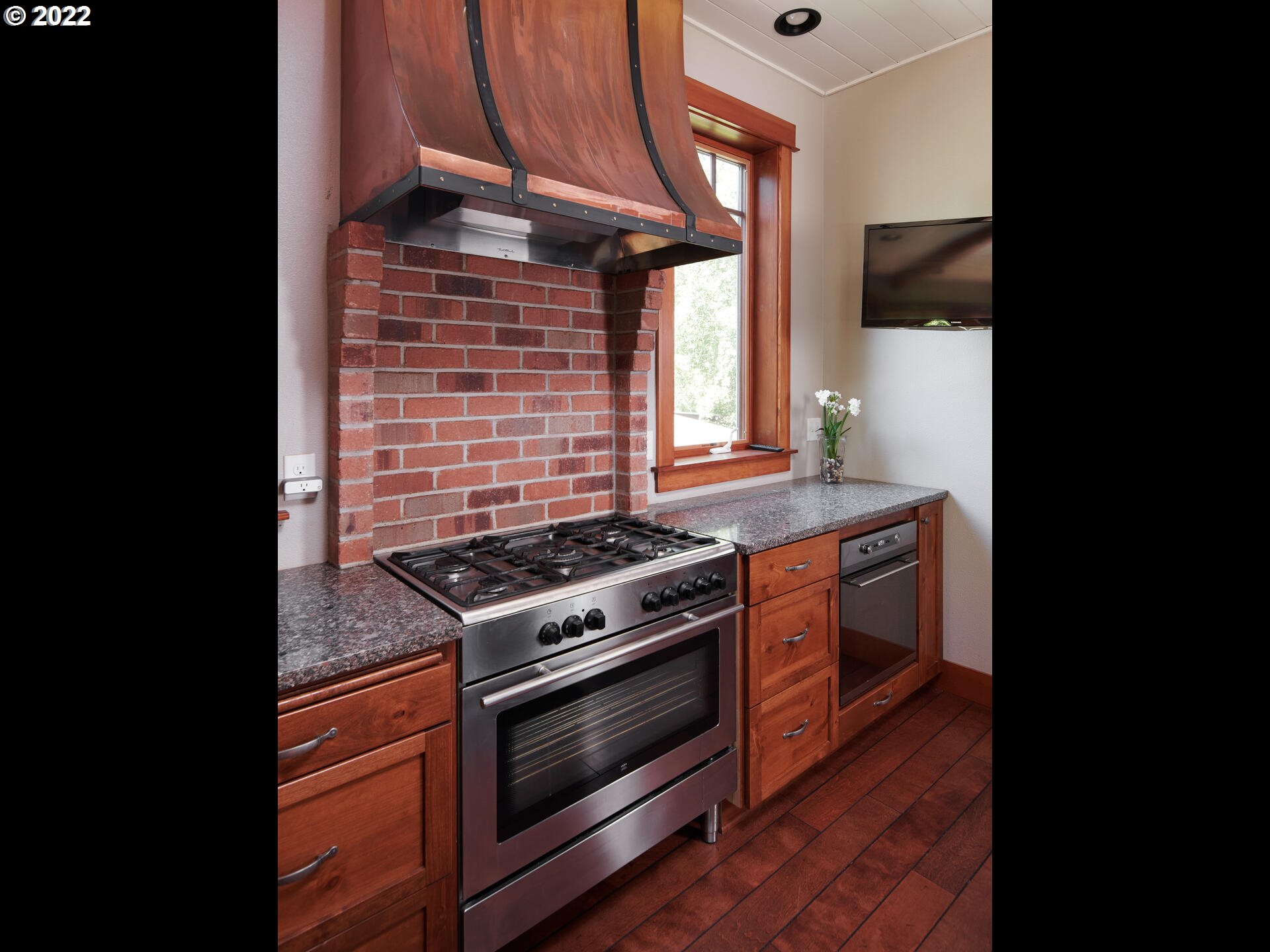4825 Southwest Evans Street Portland, OR 97219 - Photo 13 of 32 a stove top oven sitting inside of a kitchen