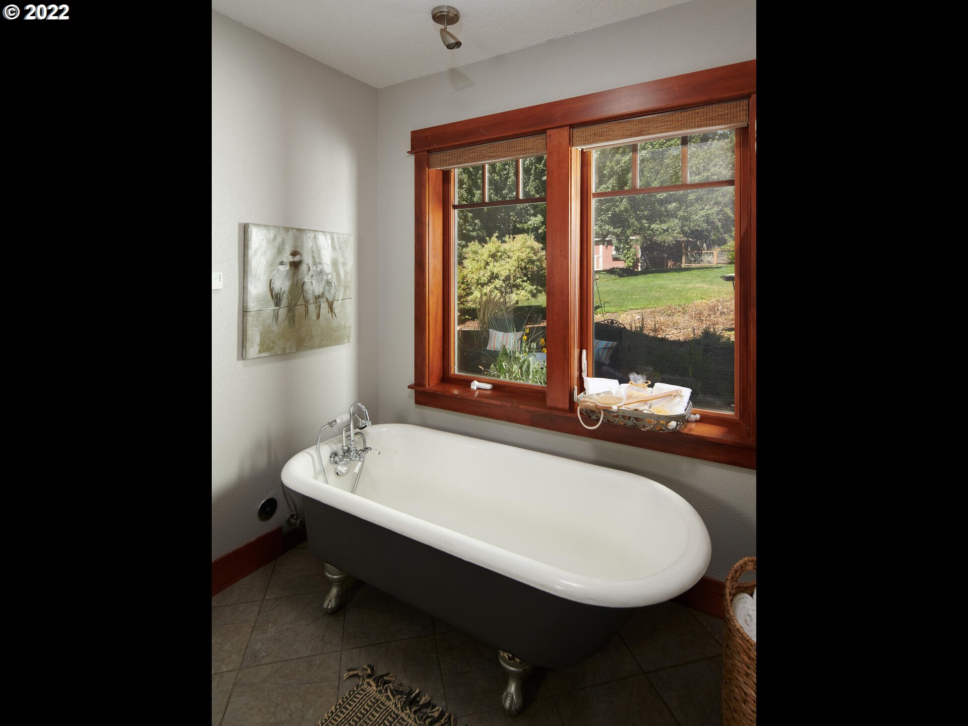 4825 Southwest Evans Street Portland, OR 97219 - Photo 15 of 32 a bathroom with a sink and a bathtub