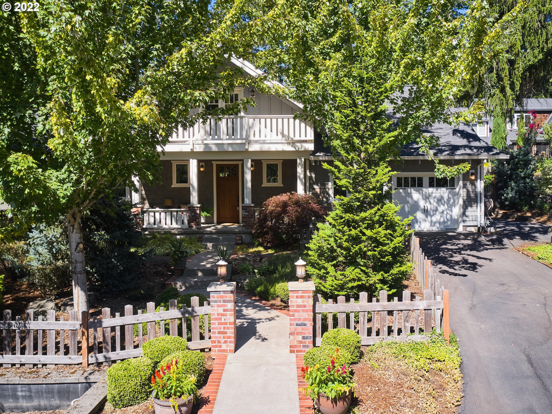 4825 Southwest Evans Street Portland, OR 97219 - Photo 2 of 32 a front view of a house with a yard
