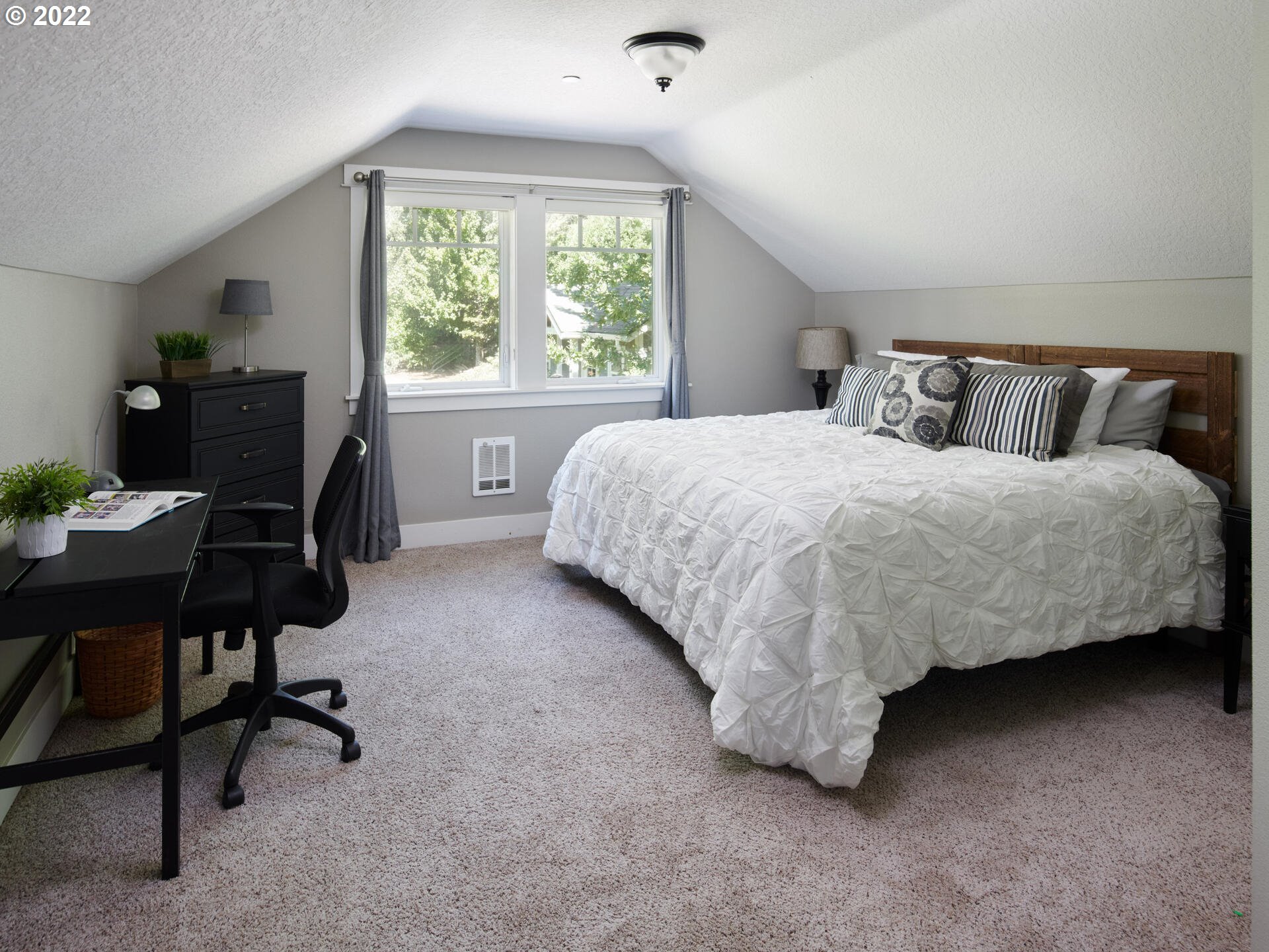 4825 Southwest Evans Street Portland, OR 97219 - Photo 21 of 32 a bedroom with a bed chair and a desk