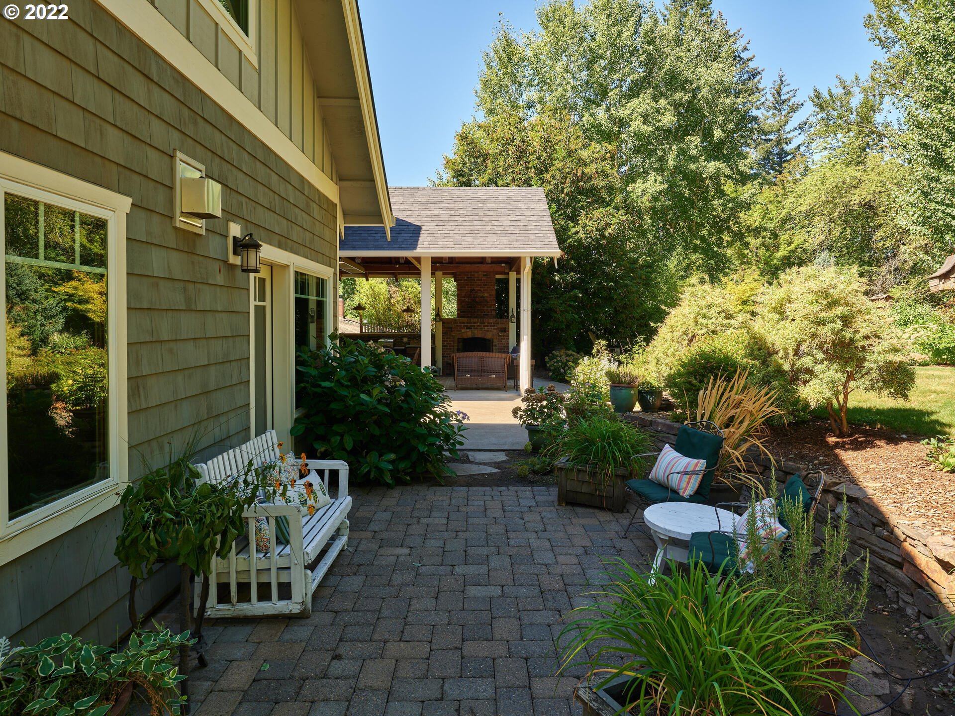 4825 Southwest Evans Street Portland, OR 97219 - Photo 23 of 32 a front view of a house with a yard