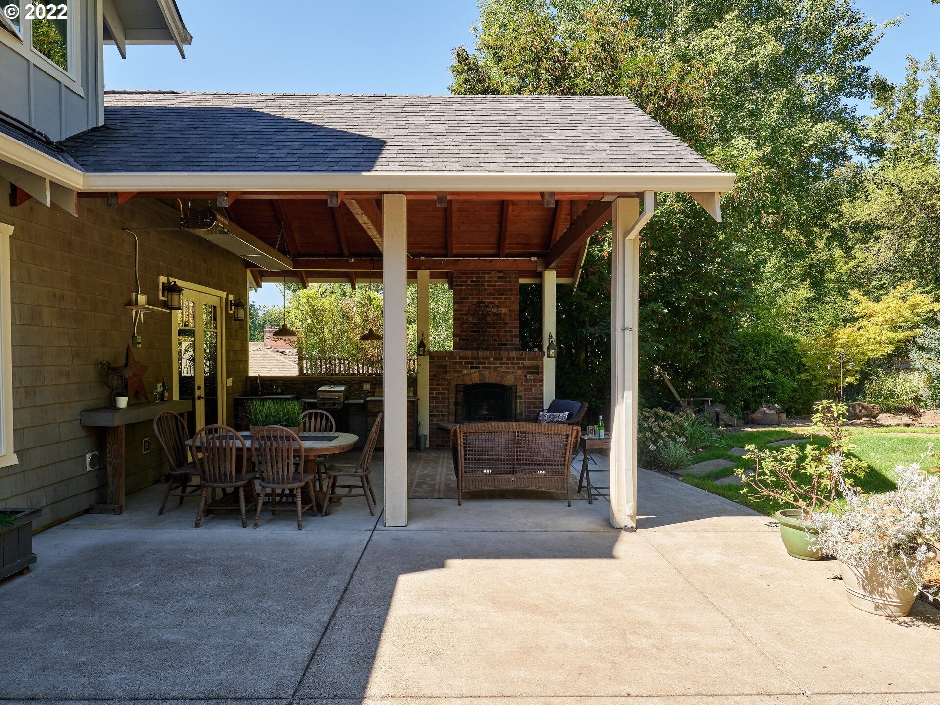 4825 Southwest Evans Street Portland, OR 97219 - Photo 24 of 32 a patio with glass table and chairs