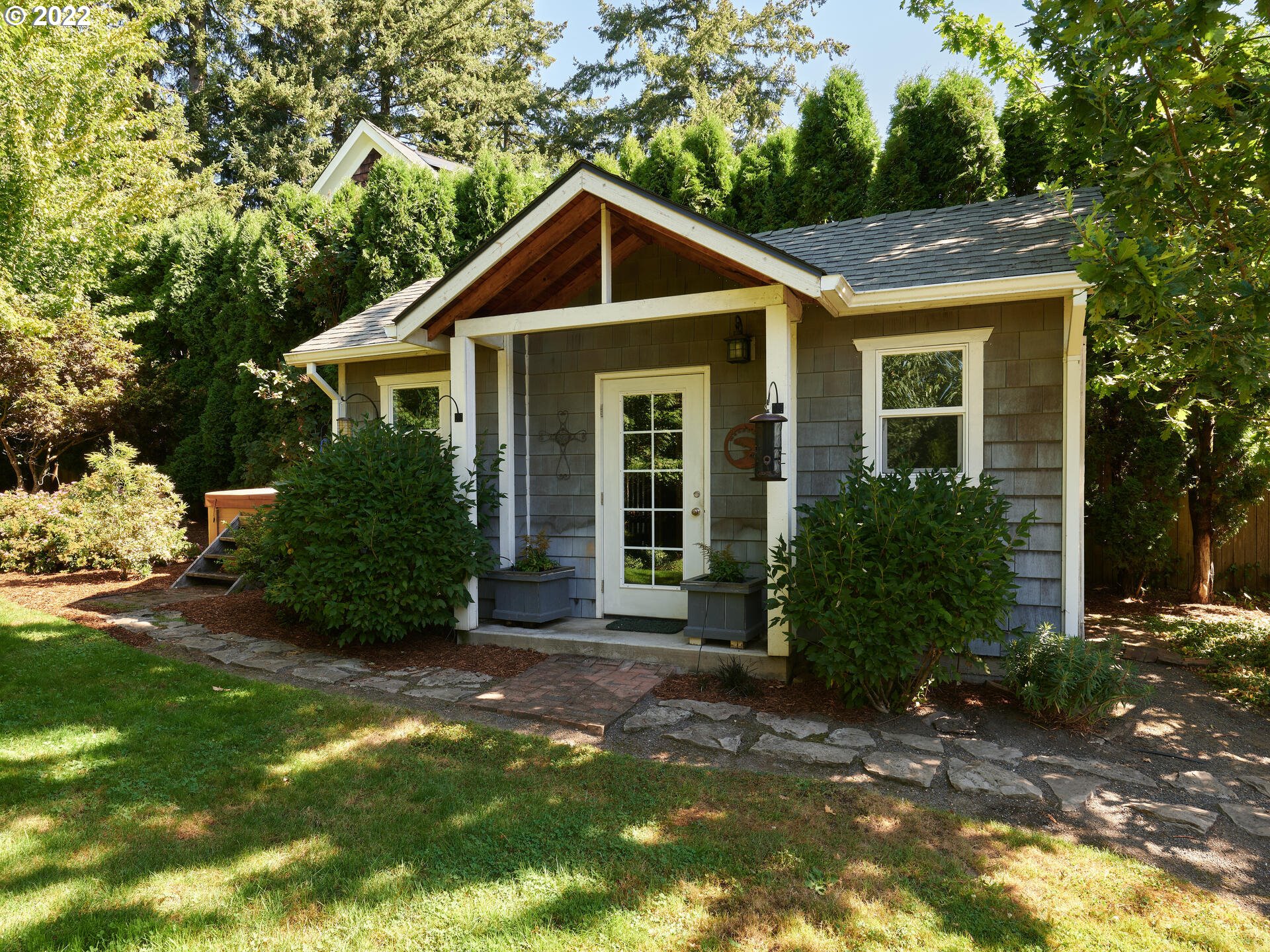 4825 Southwest Evans Street Portland, OR 97219 - Photo 27 of 32 a view of a house with a yard