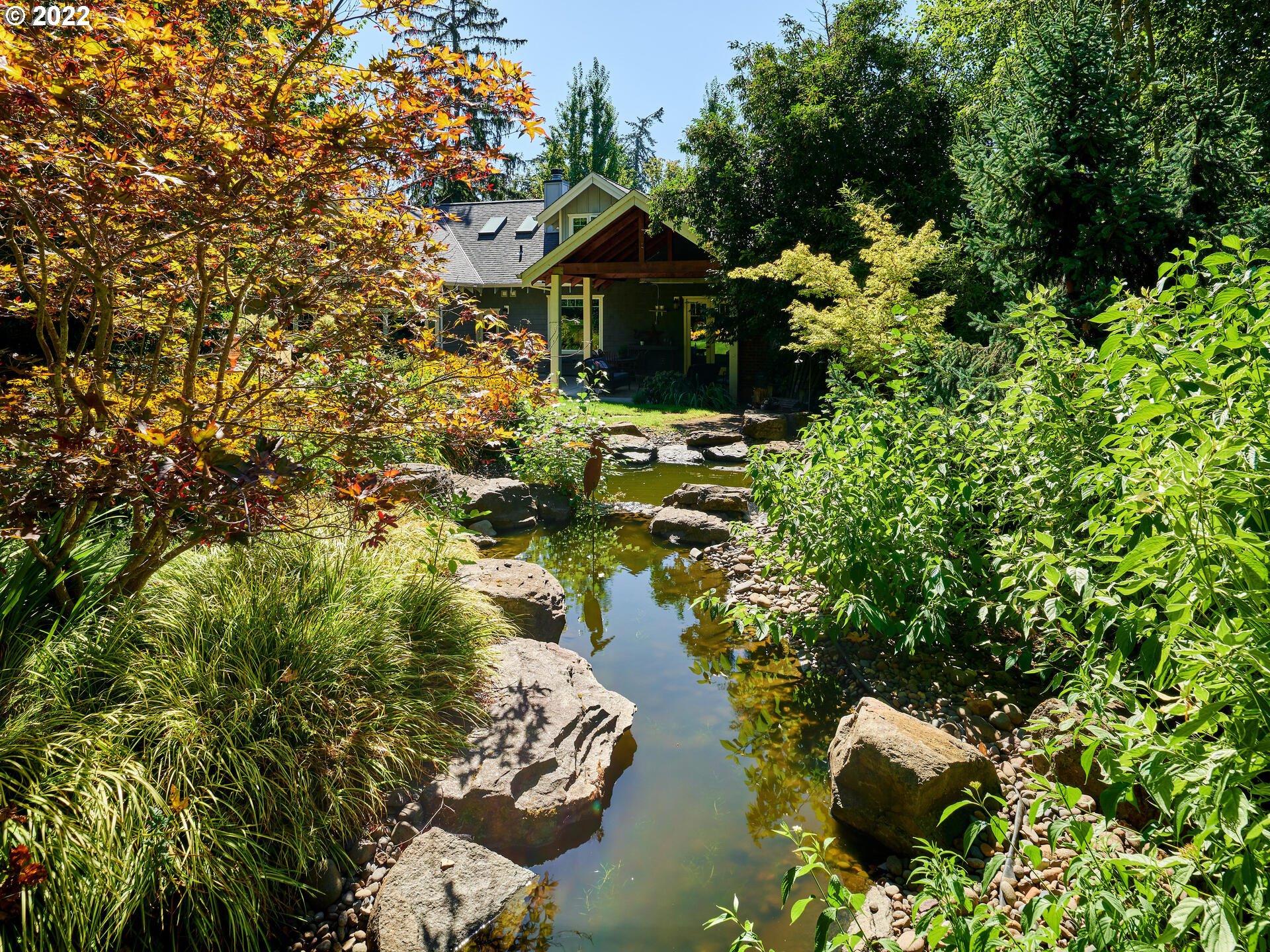 4825 Southwest Evans Street Portland, OR 97219 - Photo 30 of 32 a front view of a house with a yard