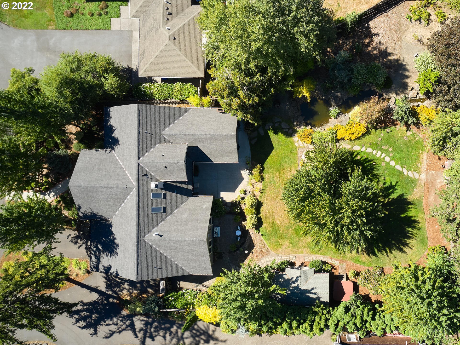 4825 Southwest Evans Street Portland, OR 97219 - Photo 31 of 32 an aerial view of a house with a yard and garden