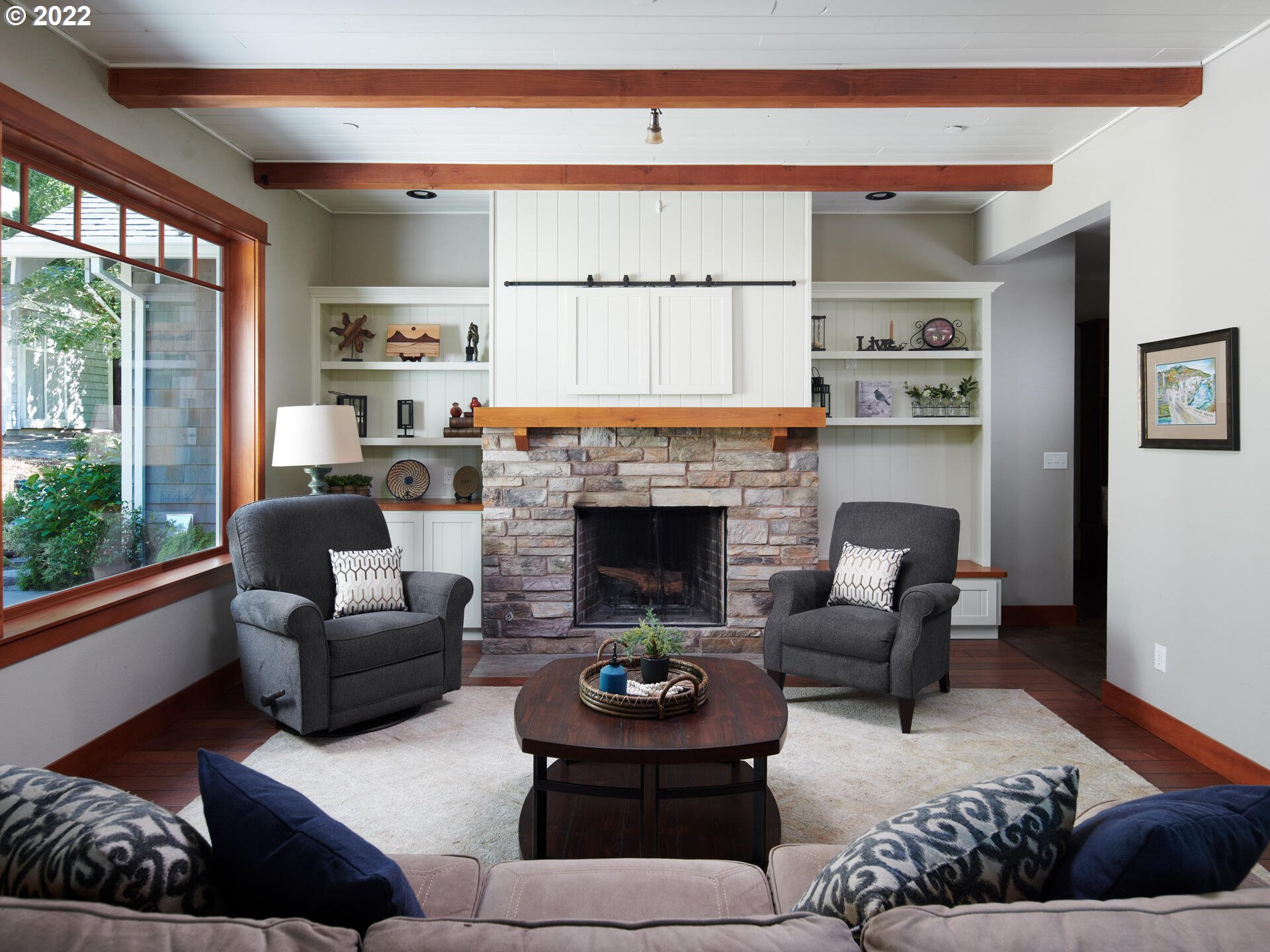 4825 Southwest Evans Street Portland, OR 97219 - Photo 7 of 32 a living room with furniture and a fireplace