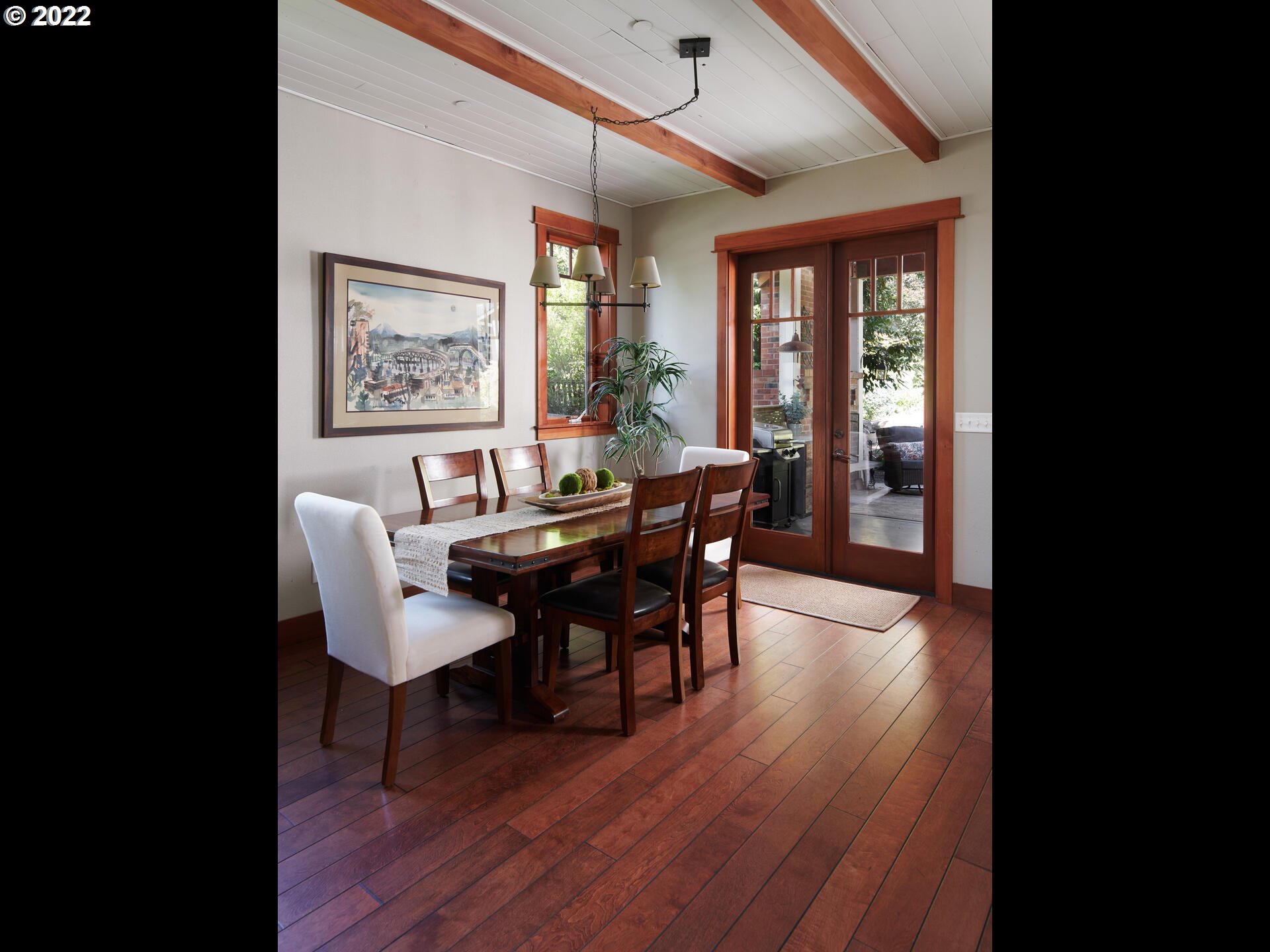 4825 Southwest Evans Street Portland, OR 97219 - Photo 9 of 32 a view of a dining room with furniture window and wooden floor