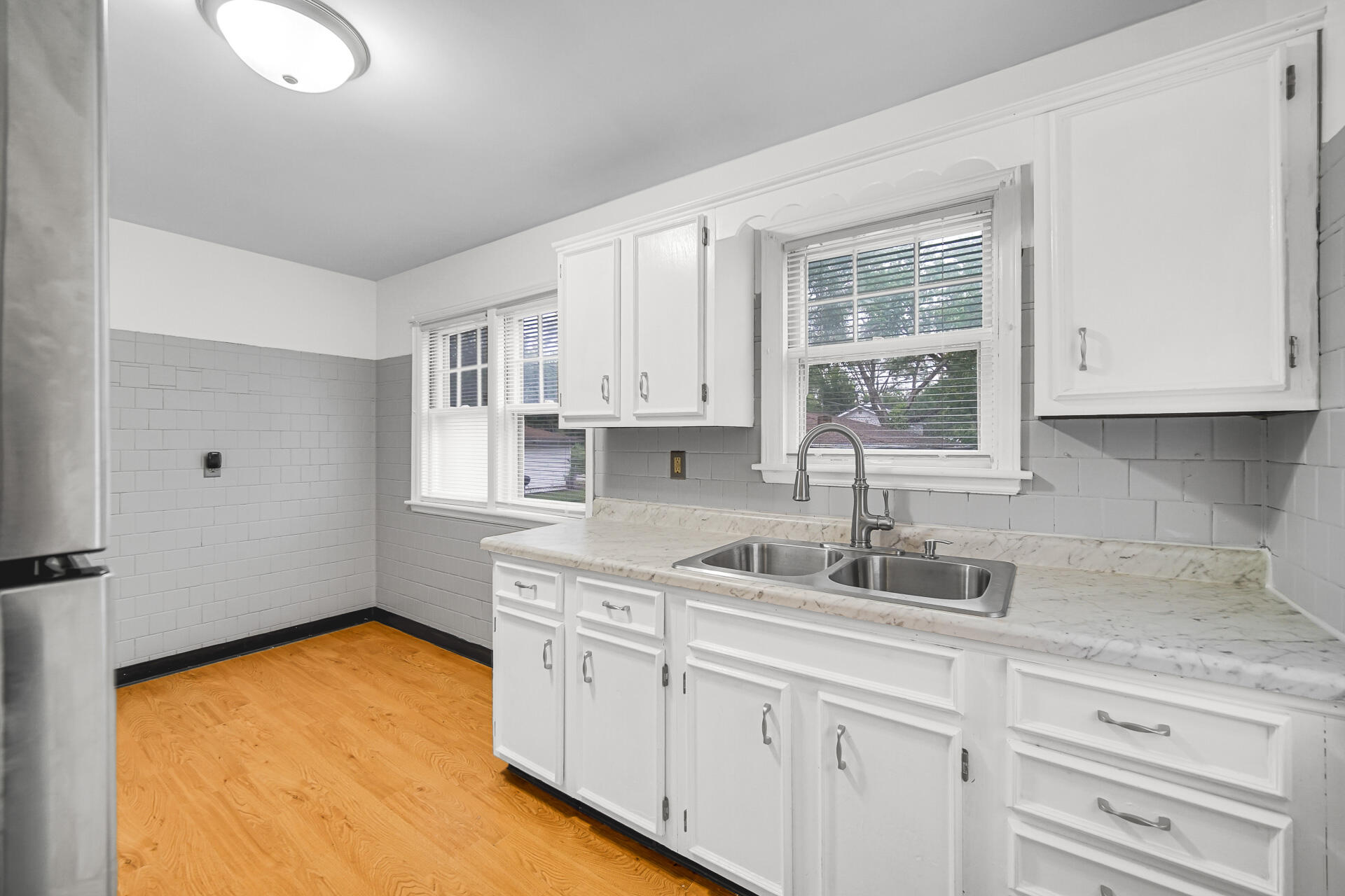 4641 Delaware Street Gary, IN 46409 - Photo 13 of 22 a kitchen with stainless steel appliances granite countertop a sink stove and cabinets