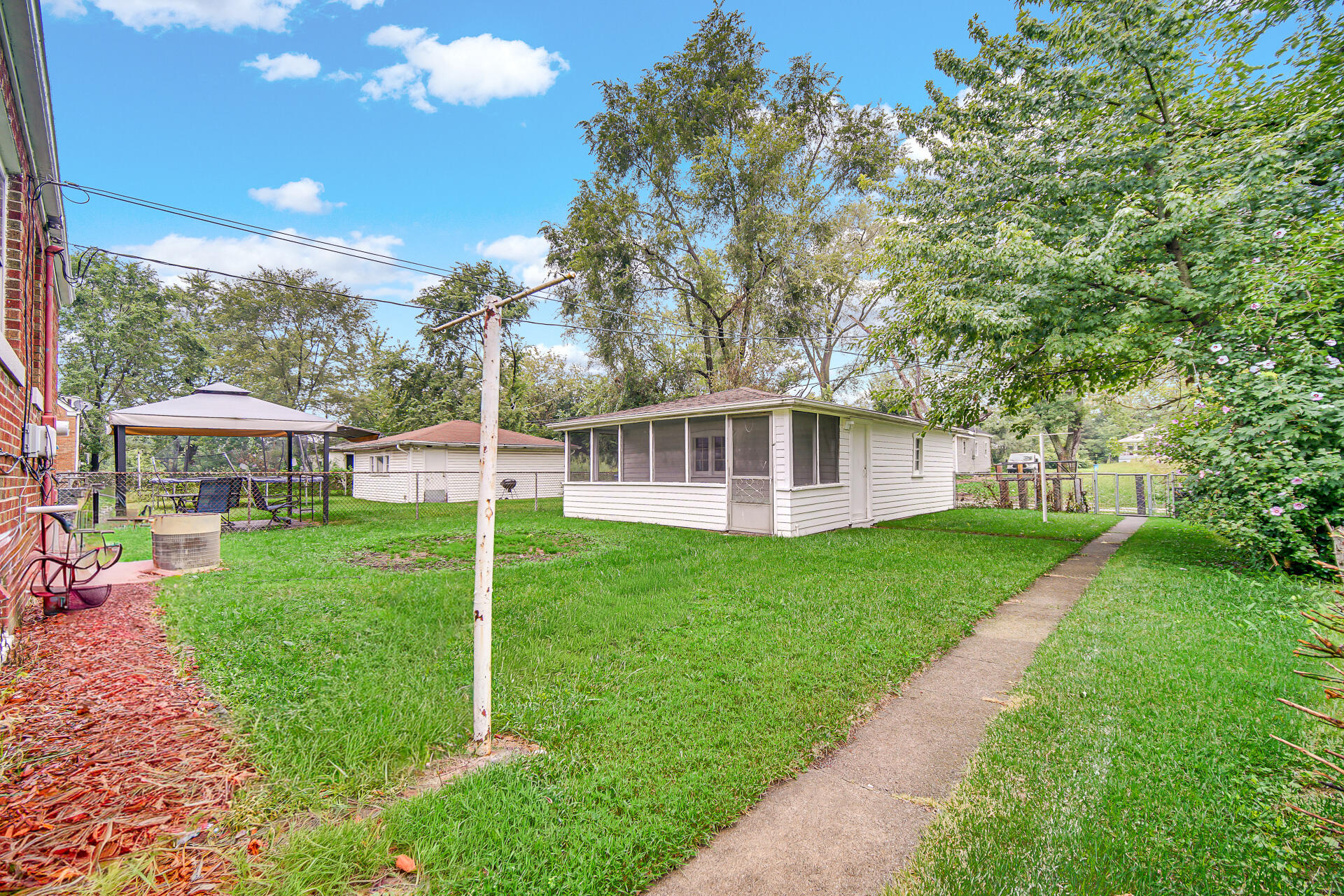 4641 Delaware Street Gary, IN 46409 - Photo 20 of 22 a view of a house with a yard