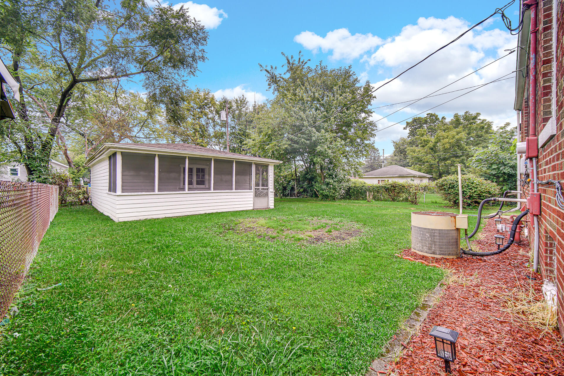 4641 Delaware Street Gary, IN 46409 - Photo 22 of 22 a view of a house with backyard sitting area and garden
