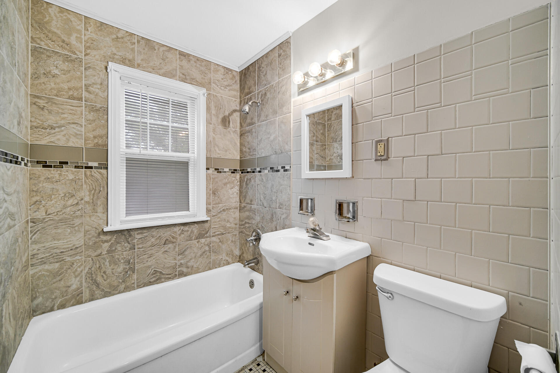4641 Delaware Street Gary, IN 46409 - Photo 9 of 22 a bathroom with a sink toilet and shower