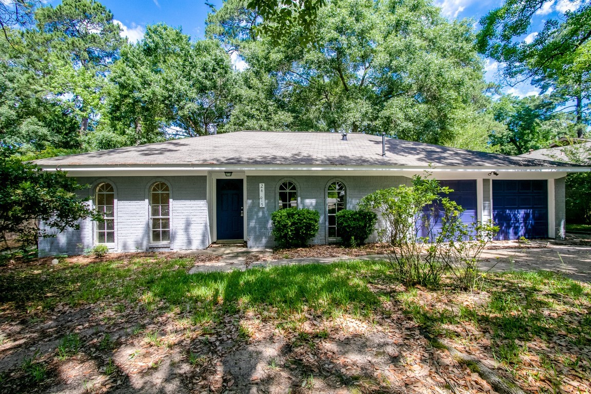 a front view of a house with a garden and porch