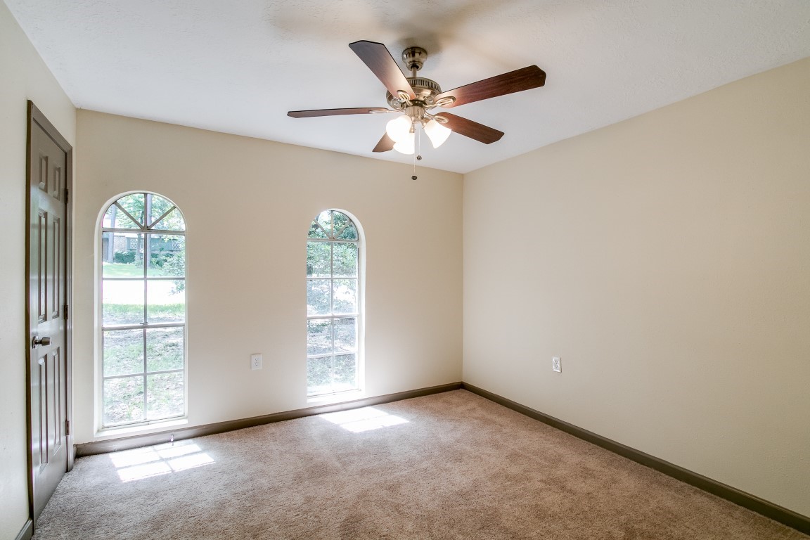 24615 Wilderness Road Spring, TX 77380 - Photo 17 of 34 an empty room with windows and fan