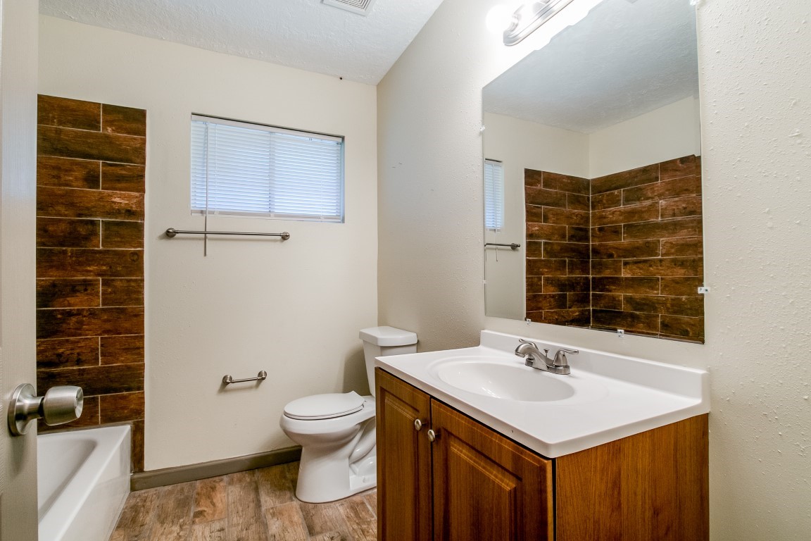 24615 Wilderness Road Spring, TX 77380 - Photo 21 of 34 a bathroom with a sink toilet and shower