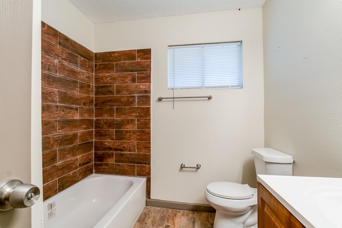 24615 Wilderness Road Spring, TX 77380 - Photo 22 of 34 a bathroom with a bathtub and toilet