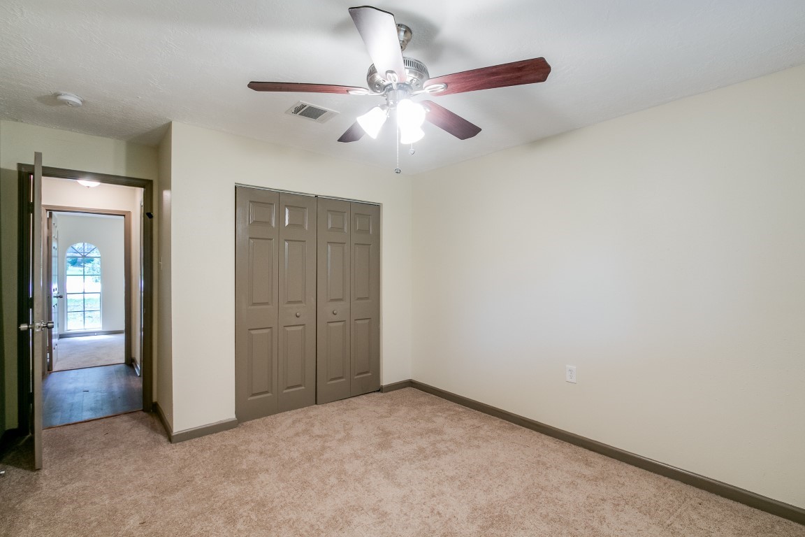 24615 Wilderness Road Spring, TX 77380 - Photo 24 of 34 an empty room with closet and fan
