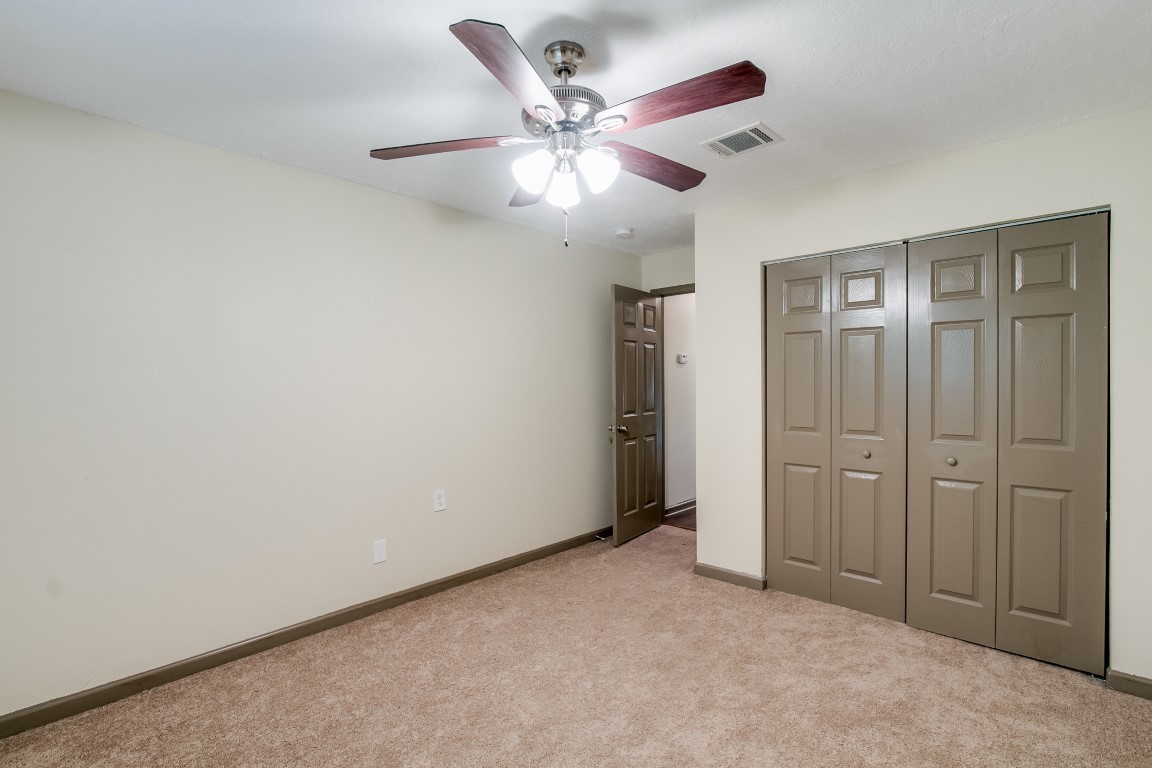 24615 Wilderness Road Spring, TX 77380 - Photo 25 of 34 an empty room with closet and fan