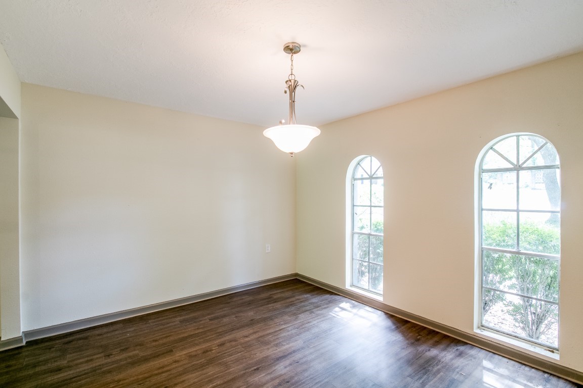 24615 Wilderness Road Spring, TX 77380 - Photo 6 of 34 a view of empty room with wooden floor and window