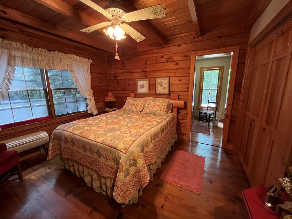 3021 Hanging Dog Road Murphy, NC 28906 - Photo 19 of 68 a bed sitting in a bedroom next to a window