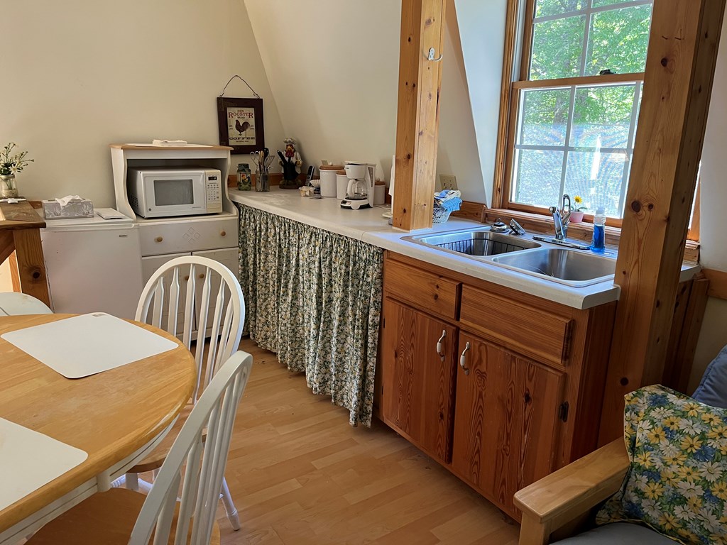 3021 Hanging Dog Road Murphy, NC 28906 - Photo 49 of 68 a kitchen with a sink a stove and a refrigerator