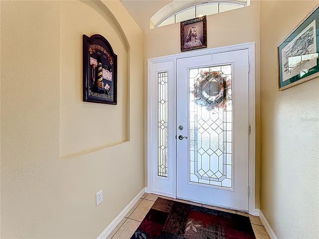 a bed room with a bed and a chandelier