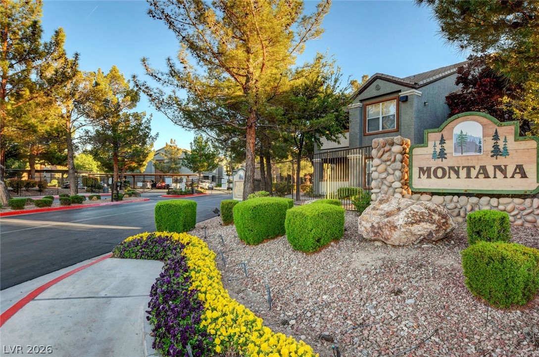 555 East Silverado Ranch Boulevard, Unit 2124 Las Vegas, NV 89183 - Photo 38 of 47 A welcoming stone-clad sign greets residents to the Montana community amidst lush landscaping.